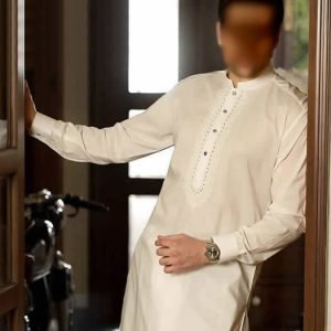 Pakistani kurta shalwar suit for men in cotton silk fabric. Off-white buttoned cuffs embroidered front kurta with matching shalwar