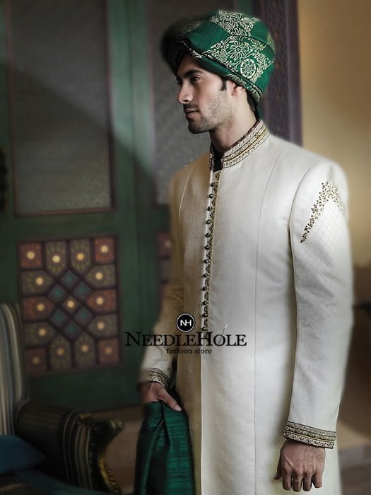 Paneled sherwani design for groom with front loop buttons