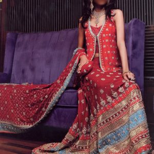 Pakistani red wedding lehenga dress for bride features fire brick under-top, flared skirt and scarf