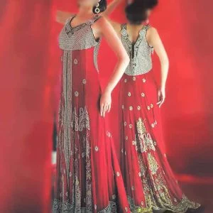 Lavishing sweep train wedding gown dress for bride in crimson color. Sweet heart neck heavy embellished bodice floor length bridal shirt comes with churidar pajama and embellished bridal dupatta