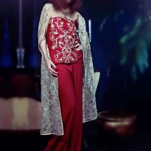 Maheen red party dress, bustier neck embroidered short length under top with sleeveless over top, flared trouser and dupatta