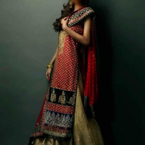 Designer wedding dress for women in lava color, round neck embellished long bridal shirt with sharara and bridal veils