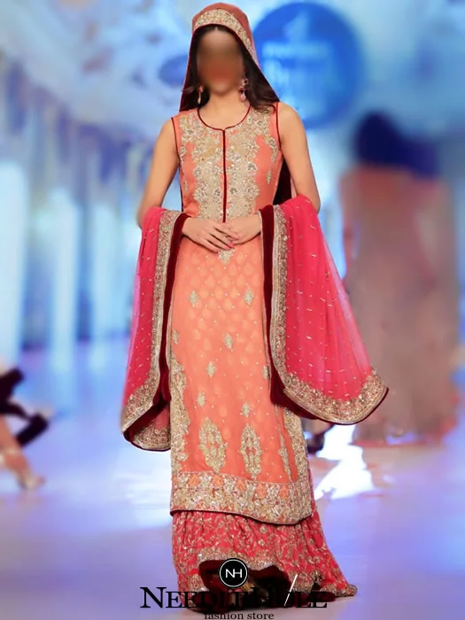 Pakistani bridal lehenga dress for wedding and reception. Round neck slight flared embellished bridal shirt with brink pink wedding lehenga and bridal dupatta