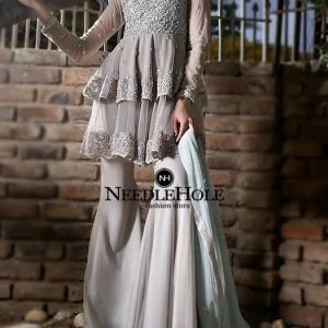 Modern Pakistani sharara style party wear in ash gray color with long fitted sleeves, double layered shirt and dupatta