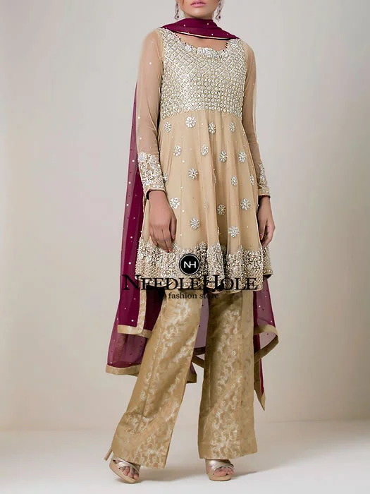 Custom made Pakistani party dress in gold color, heavy embellished bodice medium length shirt with straight trousers and dupatta