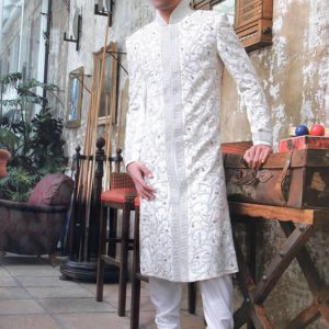 Pakistani wedding sherwani for men in offwhite color with heavy embellished collar, front and sleeves