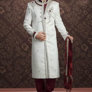 Raw silk reception sherwani for men in off-white color, embellished collar, neck, front and sleeves