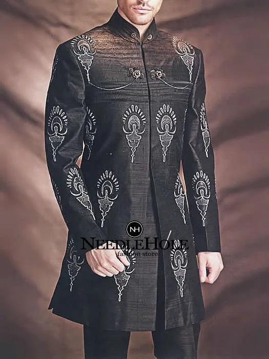 Short length groom sherwani for wedding with pajama in black color featured with large size embroidered motif all over the front and sleeves