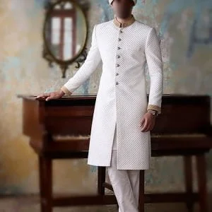 Wedding sherwani for dulha in offwhite raw silk fabric and with golden buttons, comes with kurta pajama in offwhite color